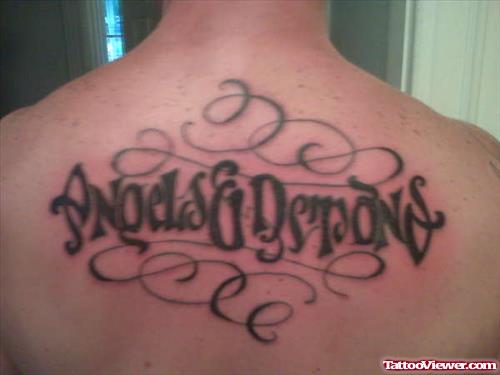 angels And Demons Ambigram Tattoo On Upperback