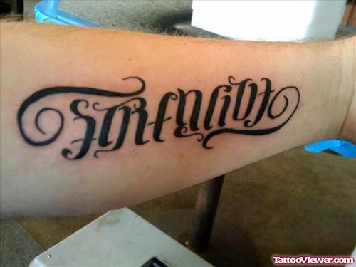 Attractive Black Ink Ambigram Tattoo On Left Arm