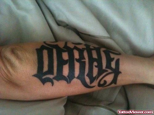 Ambigram Black Ink Left Arm Tattoo