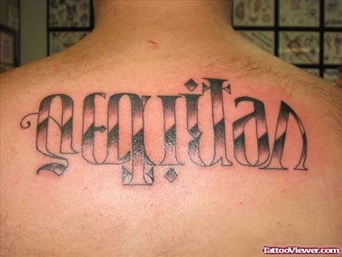 Aequitas Veritas Ambigram Tattoo On Upperback