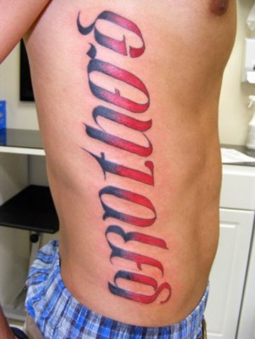 Red Ink Ambigram Tattoo On Side Rib