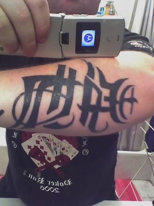 Ambigram Tattoo On Elbow