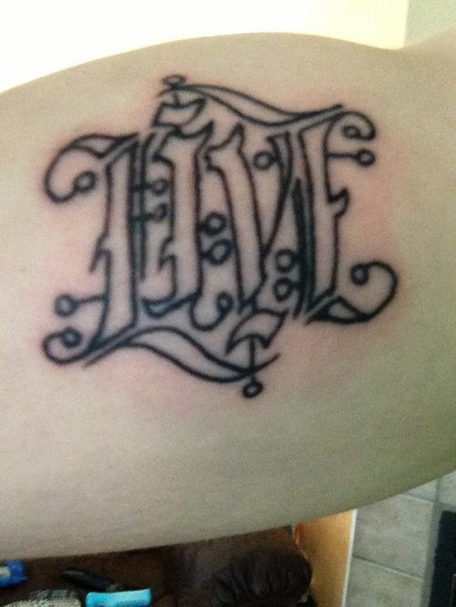 Live Ambigram Tattoo On Muscles