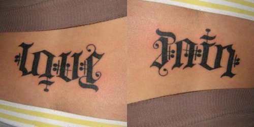 Love Pain Ambigram Tattoo On Lowerback