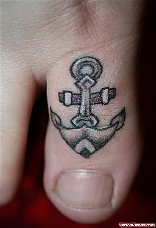 Grey Ink Anchor Tattoo On Toe