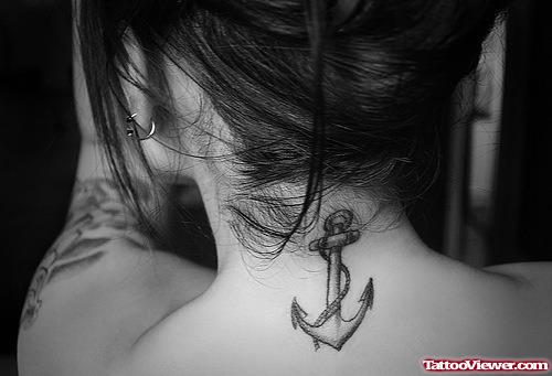 Small Anchor Tattoo On Girl Upperback