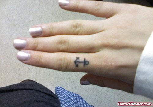 Tiny Anchor Finger Tattoo