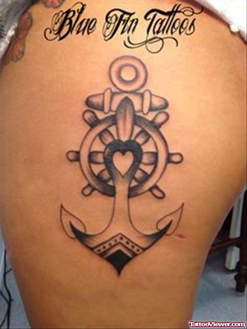 Wheel And Anchor Tattoo On Thigh