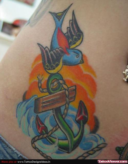 Swallow And Colored Anchor Tattoo On Hip