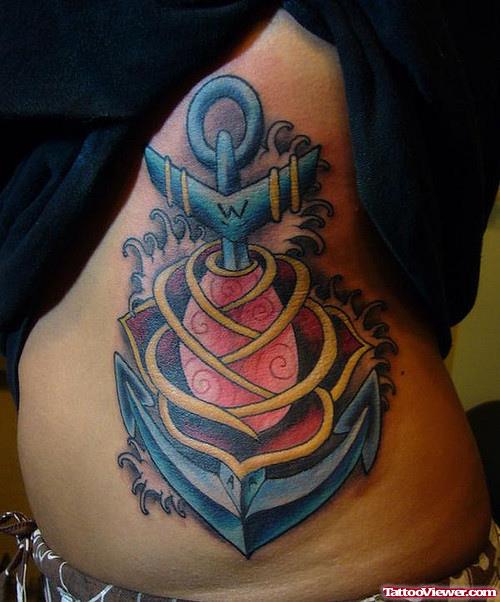 Red Rose And Blue Anchor Tattoo On Rib