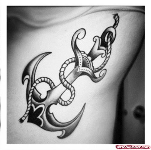 Grey Ink Anchor Tattoo On Rib Side