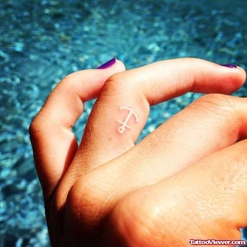 White Ink Small Anchor Tattoo On Finger