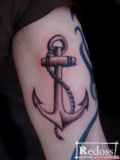 Grey Ink Anchor Tattoo On Bicep