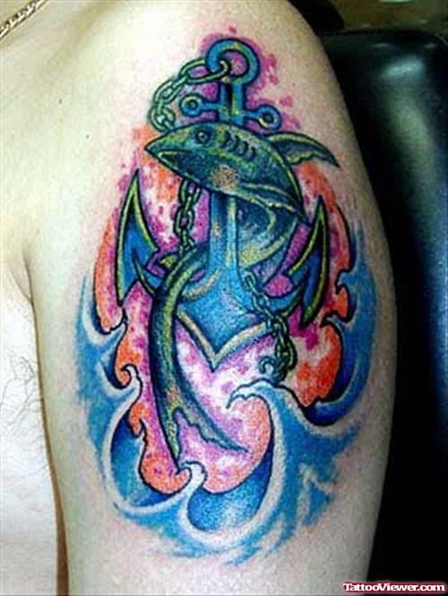 Fish And Anchor Tattoo On Man Left Shoulder