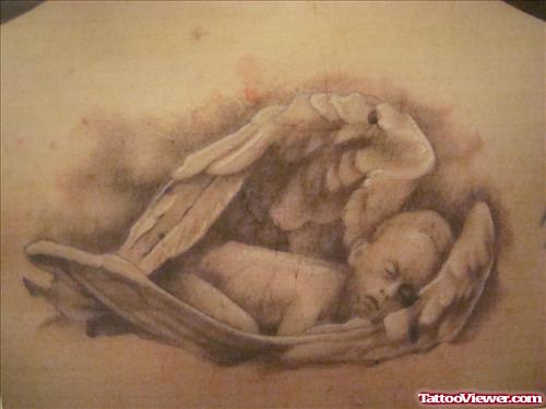 Sleeping Cherub Angel Tattoo On Back