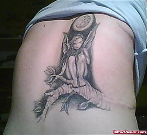 Angel Sitting On Tree Tattoo On Back