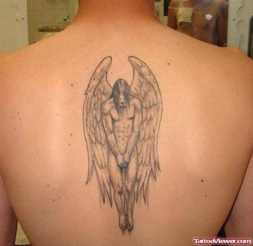 Grey Ink Male Angel Tattoo On Back