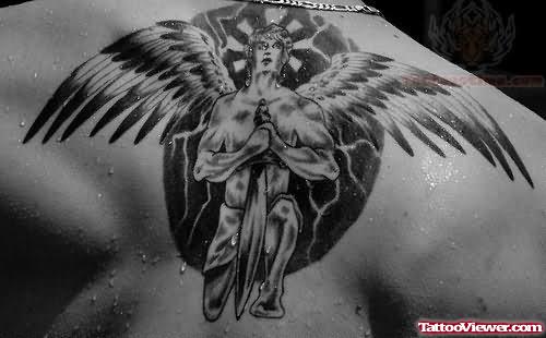 Angel With Dagger Tattoo On Upper Back