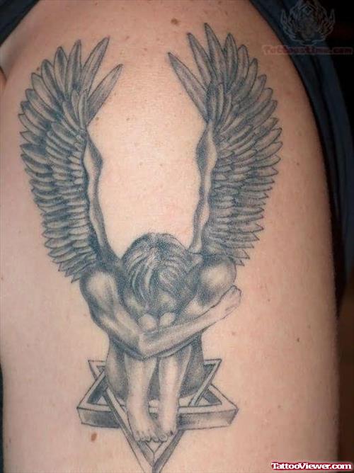 Angel Sitting On Star Tattoo