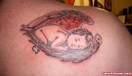 Grey Ink Baby Angel Animated Tattoo On Back Shoulder