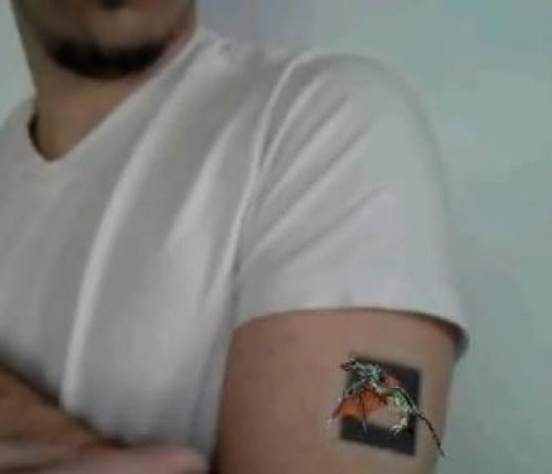 Animated Dragon Tattoo On Biceps