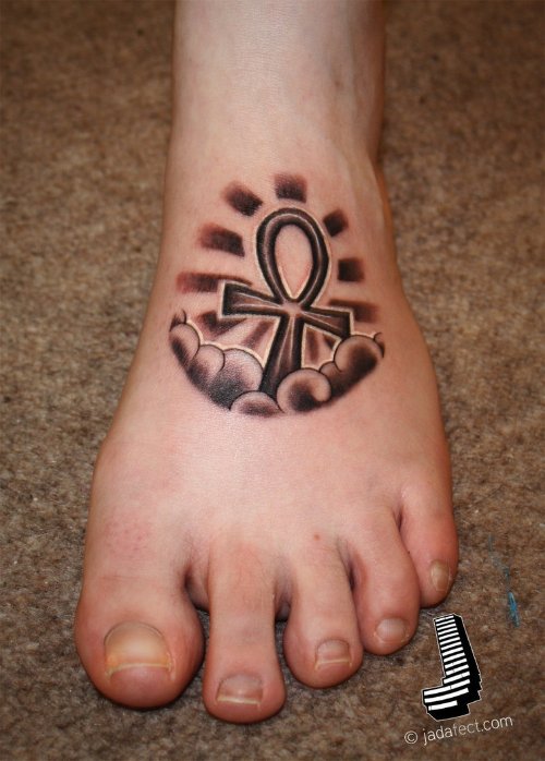Grey Ink Ankh Tattoo On Left Foot