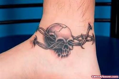 Skull And Iron Wire Tattoo On Ankle