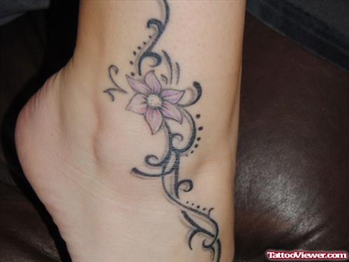 Tribal And Flower Tattoo On Girl Right ankle