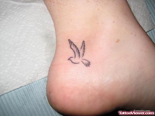 Outline Grey Ink flying Bird Ankle Tattoo