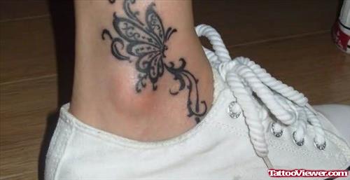 Beautiful Grey Ink Butterfly Ankle Tattoo