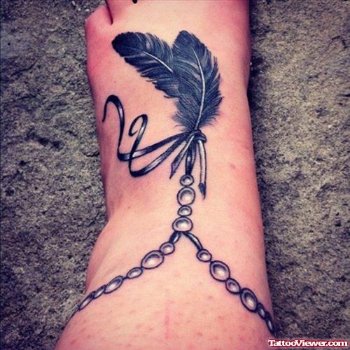 Grey Ink Feather Rosary Ankle Tattoo