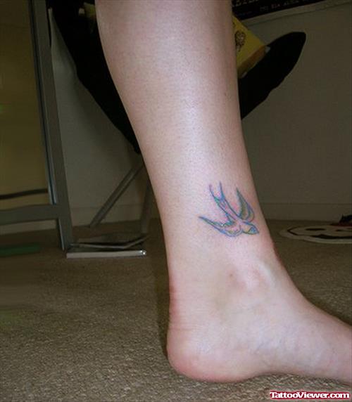 Grey Ink Flying Bird Ankle Tattoo For Girls