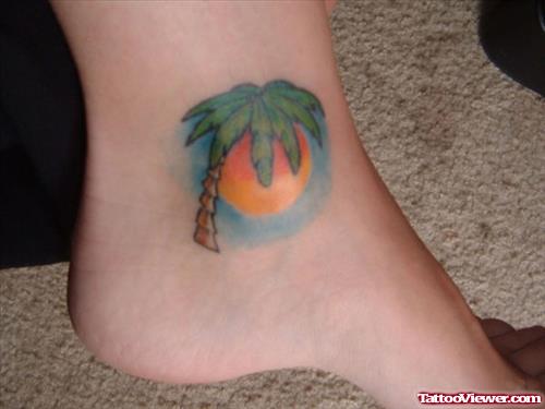 Rising Sun and Palm Tree Ankle Tattoo