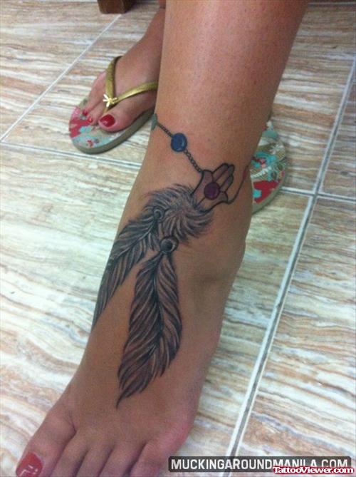 Amazing Grey Ink Feathers Tattoo On Left Ankle