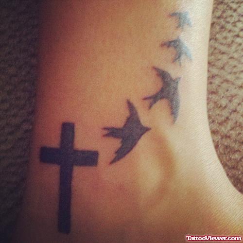 Awesome Black Cross and flying Birds Ankle Tattoo