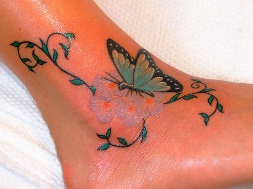 Blue Ink Butterfly Ankle Tattoo