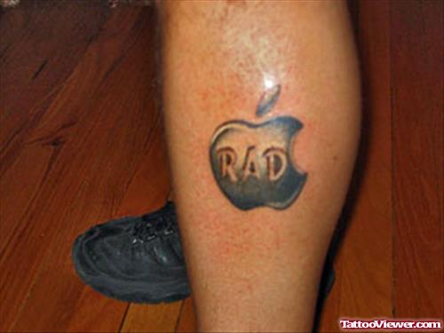 Grey Ink Rad Apple Tattoo On Left Leg