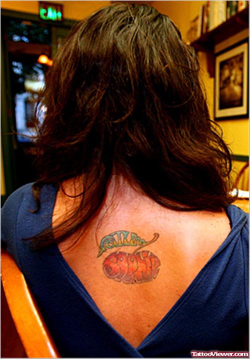 Red Ink Apple Tattoo On Upperback