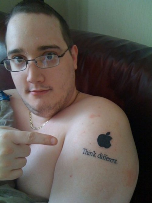 Guy Showing Apple Tattoo On Left Shoulder