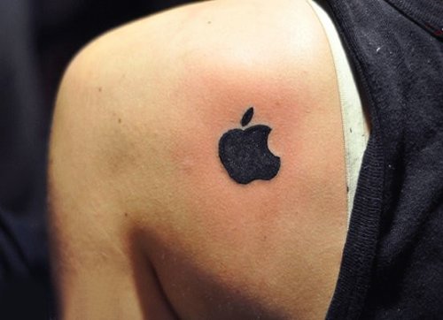 Black Ink Apple Logo Tattoo On Left Back SHoulder