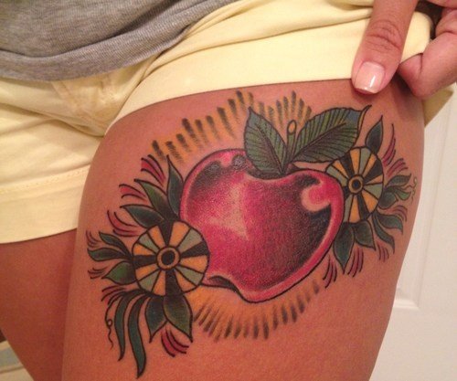 Flower And Apple Tattoo On Left Thigh