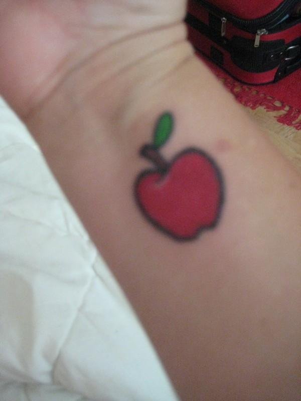 Red Apple Tattoo On Right Forearm