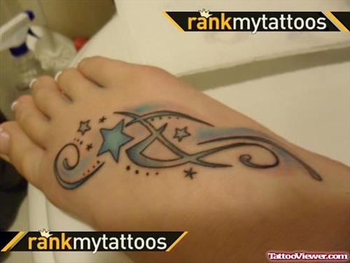 Blue Ink Tribal And Star Aqua Tattoo On Right Foot
