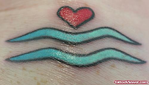 Tiny Red Heart And Aquarius Tattoo