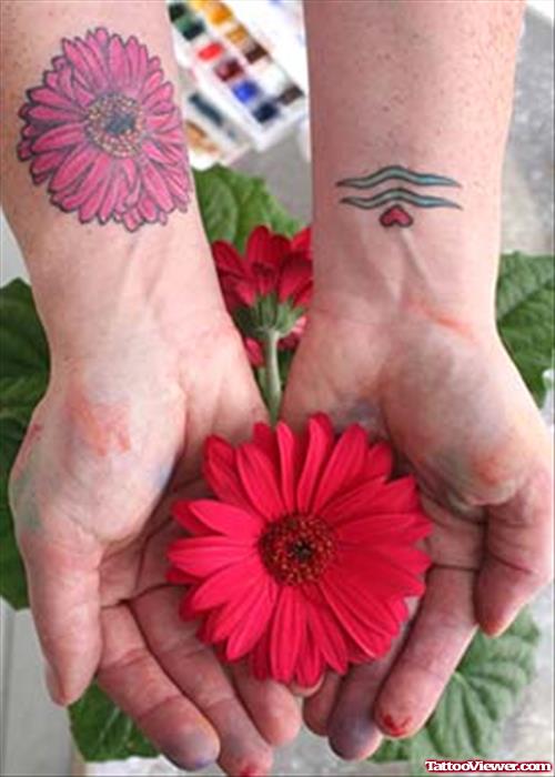 Flower And Aquarius Zodiac Tattoos On Wrists
