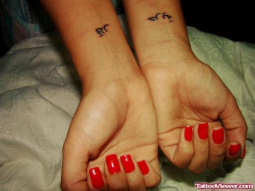 Arabic Tattoos On Girl Wrists