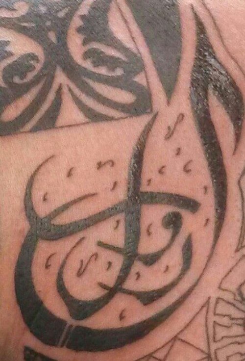 Black Ink Tribal Arabic Tattoo