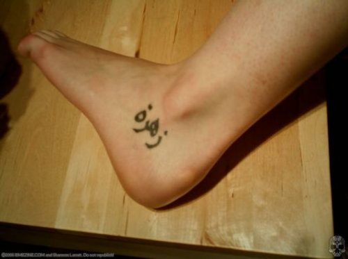 Beautiful Arabic Tattoo On Left Foot