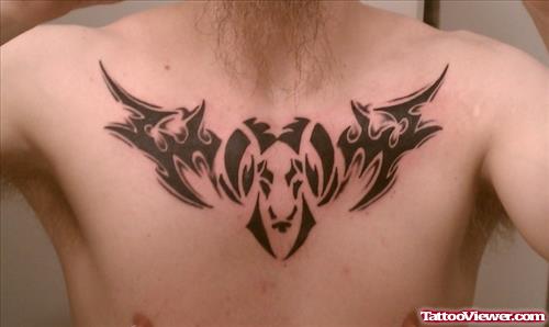 Tribal And Aries Head Tattoo On Man Chest