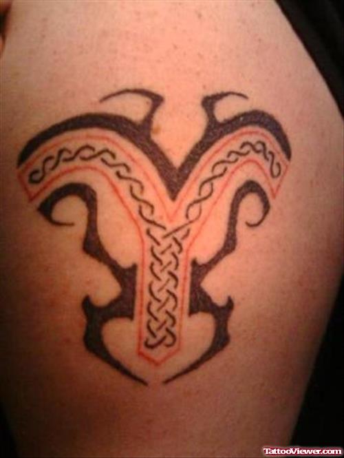 Amazing Black Tribal And Aries Tattoo